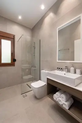 a bathroom with a sink and a toilet and a shower at My Pixida Apartments in Rhodes Town