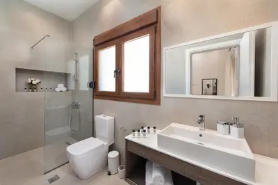 a bathroom with a sink and a toilet and a shower at My Pixida Apartments in Rhodes Town