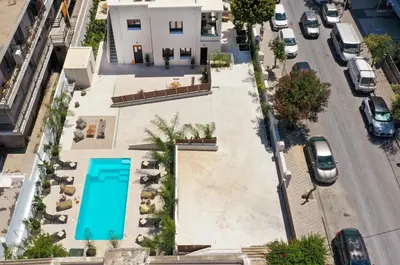 an overhead view of a pool on a city street at My Pixida Apartments in Rhodes Town