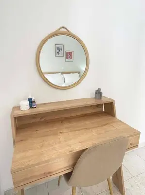 a dressing table with a mirror and a chair at Gravity Ialysos Scandi Suite in Ialyssos