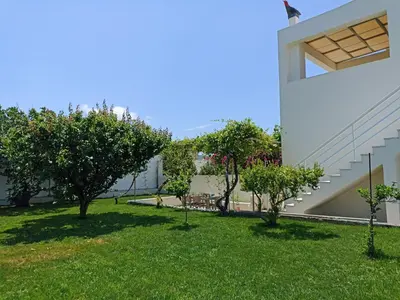 a view of the yard of a house with trees at Kristallia - Kattavia surf houses in Kattavía