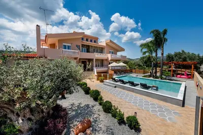a villa with a swimming pool and a house at Luxury Villa Barbara Afandou Rhodes in Afantou