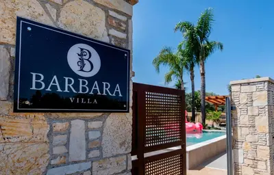 a sign for a barbara villa on the side of a building at Luxury Villa Barbara Afandou Rhodes in Afantou