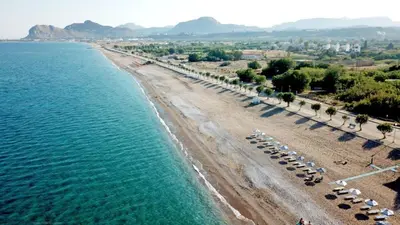 an aerial view of a beach with umbrellas at Luxury Villa Barbara Afandou Rhodes in Afantou
