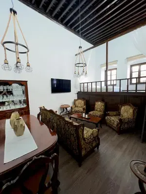 a living room with couches and a table at Villa AleNi Lindos in Líndos