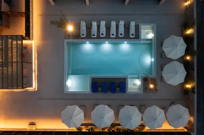an overhead view of a swimming pool at night at Prasonisi Lighthouse Boutique Hotel in Prasonisi