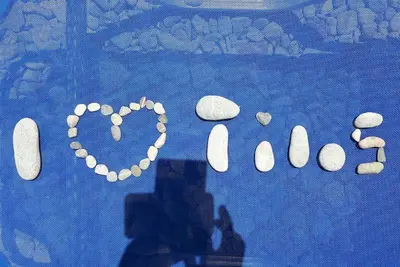 a painting of the word rock written on the ground at Pavlos Rooms in Livadia