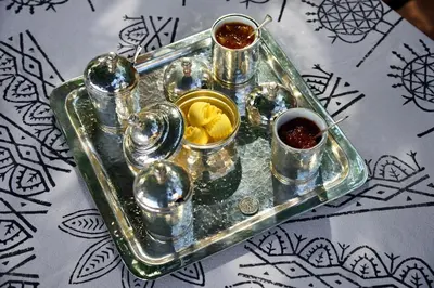 a glass tray with condiments on top of a table at Villa Melenos Lindos in Líndos