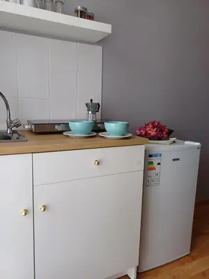 a kitchen with two bowls on top of a counter at ZEUS Studios in Rhodes Town