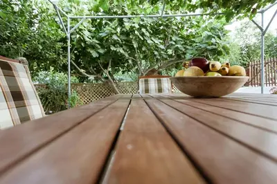 a bowl of fruit sitting on top of a wooden table at Serenity Studio for couples in Rhodes Town