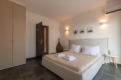 a bedroom with a bed with two towels on it at Villa Katerina in Líndos