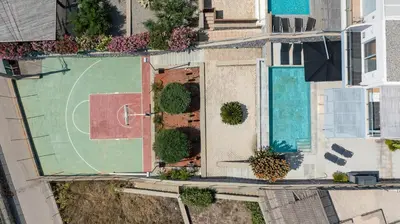 an overhead view of a backyard with a basketball court at Villa Katerina in Líndos