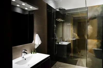 a bathroom with a sink and a shower at namaste in Rhodes Town
