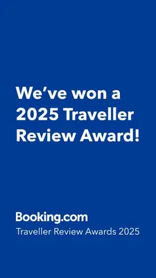 a blue sign that says weve won a traveler review award at namaste in Rhodes Town