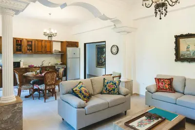 a living room with a couch and a table at Anemoessa Mansion in Rhodes Town