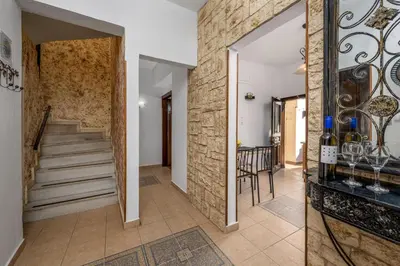 a hallway of a home with a stone wall at Old Town Villa in Rhodes Town