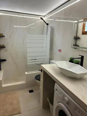 a bathroom with a sink and a toilet and a shower at Old Town Villa in Rhodes Town