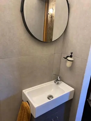 a bathroom with a sink and a mirror at Old Town Villa in Rhodes Town