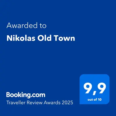 a blue sign with the text awarded to nikolas old town at Nikolas Old Town in Rhodes Town