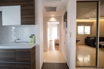 a kitchen and a living room with a hallway at Savvina's residence in Rhodes Town