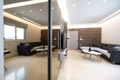 a living room with couches and a table at Savvina's residence in Rhodes Town