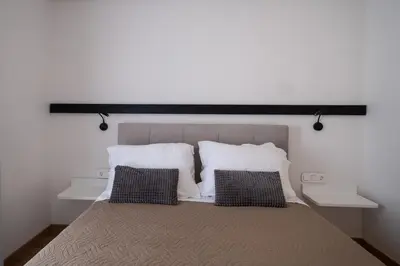 a bedroom with a large bed with two pillows at Savvina's residence in Rhodes Town