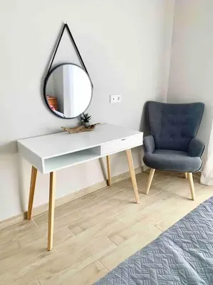 a white desk with a mirror and a blue chair at Luxury cozy appartment in the city center in Rhodes Town