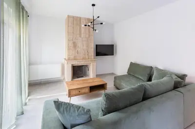 a living room with a couch and a fireplace at Rhodes City Center Apartments in Rhodes Town