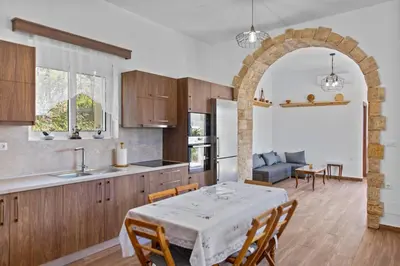 a kitchen and a dining room with a table and chairs at Alonia Traditional House in Malona in Malona Village