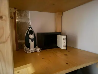 a room with a tv and a table in a room at Antica Casa Dei Nonni in Archangelos