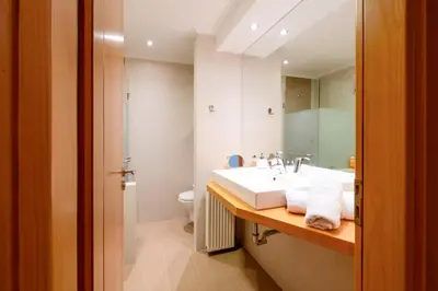 a bathroom with a sink and a toilet at Grace Luxury Apartment next to Old Town in Rhodes Town