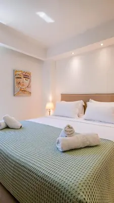 two beds sitting next to each other in a bedroom at Grace Luxury Apartment next to Old Town in Rhodes Town