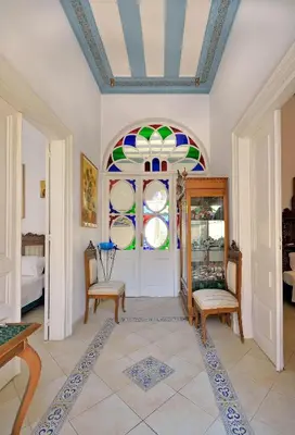 a room with a door with a stained glass window at Casa Di Rodi in Rhodes Town