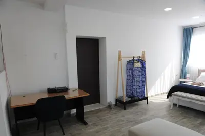 a room with a desk and a bed and a bedroom at El Angel by Ntinos in Kremasti