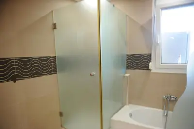a bathroom with a shower and a sink at El Angel by Ntinos in Kremasti