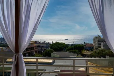 a view of the ocean from a balcony at Harama House - Seaview City Apt. in Rhodes Town