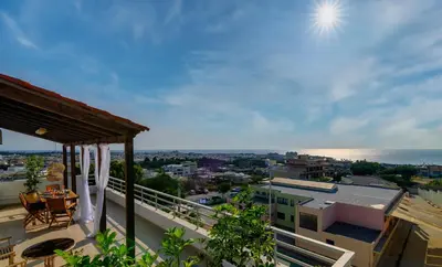 a balcony with a view of a city at Harama House - Seaview City Apt. in Rhodes Town