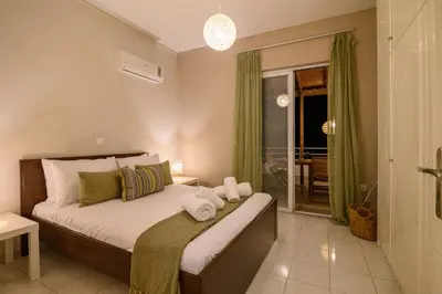 a bedroom with a bed with towels on it at Harama House - Seaview City Apt. in Rhodes Town
