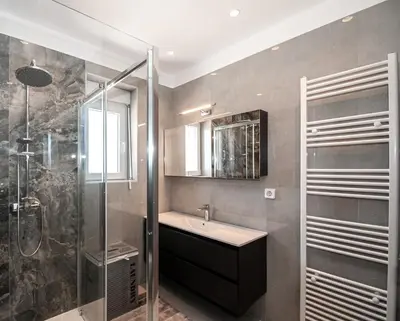 a bathroom with a sink and a shower at Agnanti Sea View Villa in Koskinou
