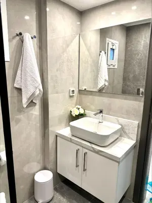 a bathroom with a white sink and a mirror at Flev's Luxury House with pool in Kremasti
