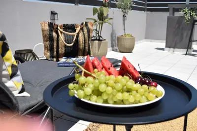 a plate of fruit and vegetables on a table at Stamatina's Luxury Penthouse in Pastida Rhodes in Pastida