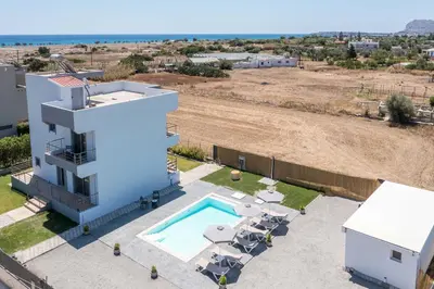 an aerial view of a house with a swimming pool at Captain Chris Villa in Afantou