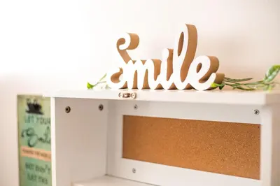 a white shelf with a smile sign on top of it at Marco Beach Tiny House in Faliraki