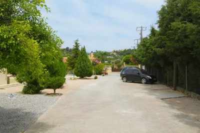 a car parked in a driveway with a fence at Treditto House - Ground Floor residence C1 in Koskinou