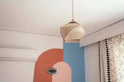 a wicker basket hanging from a ceiling at Villager's Art Apartment in Paradeísion