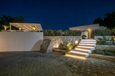 a house with stairs in front of a building at Ocean Pearl Sea View in Faliraki