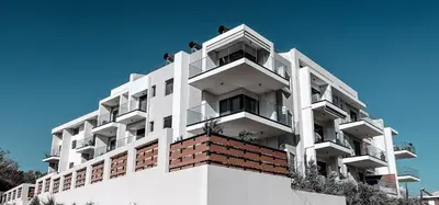 a white building with balconies on top of it at Wohlfühloase 1 Casa Elena und Gerd in Rhodes Town