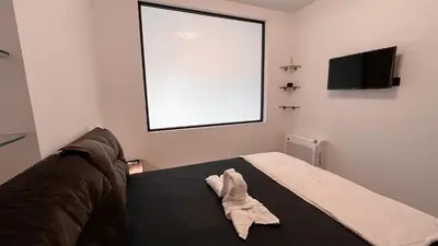 a towel is sitting on a bed in a room at Wohlfühloase 1 Casa Elena und Gerd in Rhodes Town