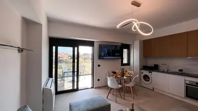 a kitchen with a table and a dining room at Wohlfühloase 1 Casa Elena und Gerd in Rhodes Town