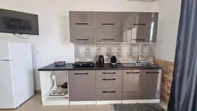 a kitchen with a sink and a counter top at Studio Mare Faliraki in Faliraki